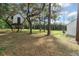 Backyard featuring a large lawn and a treehouse at 1109 Brownshire Ct, Longwood, FL 32779