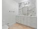 A well lit bathroom, complete with white marble style backsplash and vanity at 1109 Brownshire Ct, Longwood, FL 32779