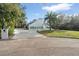 Contemporary home exterior featuring a manicured lawn and white exterior at 1109 Brownshire Ct, Longwood, FL 32779