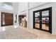 Grand foyer with marble flooring and contemporary design elements at 1109 Brownshire Ct, Longwood, FL 32779