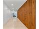 Hallway featuring custom wood paneling and white walls at 1109 Brownshire Ct, Longwood, FL 32779