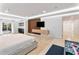 Bright main bedroom with wood accent wall, floating shelves, and access to patio at 1109 Brownshire Ct, Longwood, FL 32779