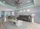 Open concept living space with TV, couch, large patterned rug, and dining room at 1132 Fins Up Ct, Daytona Beach, FL 32124