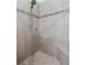 Modern shower featuring gray tiled walls, mosaic accent tiles and a built-in seat at 1132 Fins Up Ct, Daytona Beach, FL 32124