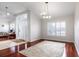 Bright living room featuring hardwood floors and plantation shutters at 1165 Cardinal Creek Pl, Oviedo, FL 32765