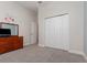 Cozy bedroom with carpeted floors, closet space, and neutral paint at 1224 Shorecrest Cir, Clermont, FL 34711
