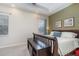 Comfortable bedroom featuring a paneled accent wall and neutral décor for a relaxing retreat at 1224 Shorecrest Cir, Clermont, FL 34711