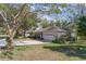 Lovely single-story home boasting mature trees, a well-maintained lawn, and a two-car garage at 1224 Shorecrest Cir, Clermont, FL 34711