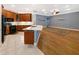Open-concept kitchen with an island, seamlessly connected to the adjacent living area at 1224 Shorecrest Cir, Clermont, FL 34711
