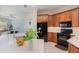 Modern kitchen boasts white countertops, stainless steel appliances, and ample cabinet space at 1224 Shorecrest Cir, Clermont, FL 34711