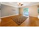 Bright and airy living room features hardwood floors and a sliding glass door at 1224 Shorecrest Cir, Clermont, FL 34711
