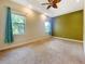 Spacious bedroom featuring neutral walls, carpeted floors, and ample natural light at 1224 Shorecrest Cir, Clermont, FL 34711
