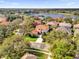 Great aerial view of a home that features a circular driveway and mature landscaping at 1246 Pallister Ln, Lake Mary, FL 32746