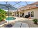 A screened in pool, patio furniture, and a grill make this backyard perfect for entertaining at 1246 Pallister Ln, Lake Mary, FL 32746