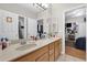 Functional bathroom featuring a double vanity, mirrors, and an attached shower and toilet area at 1246 Pallister Ln, Lake Mary, FL 32746
