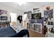 Bedroom with record collection, posters, record player, and attached bathroom and dining area at 1246 Pallister Ln, Lake Mary, FL 32746