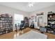Spacious bedroom with a desk, ample shelving, hardwood floors, and unique decor at 1246 Pallister Ln, Lake Mary, FL 32746