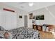 Cozy bedroom featuring hardwood floors, ceiling fan, and pop-culture decor at 1246 Pallister Ln, Lake Mary, FL 32746