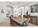 Spacious dining room with a wooden table, arched entryways, and a chandelier at 1246 Pallister Ln, Lake Mary, FL 32746
