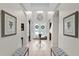 Grand foyer with soaring ceilings, arched doorways, tile floors, and elegant decor and furnishings at 1246 Pallister Ln, Lake Mary, FL 32746