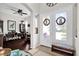 Inviting foyer with a double-door entrance, tile flooring, and views into the dining and living areas at 1246 Pallister Ln, Lake Mary, FL 32746
