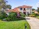 Beautiful two-story home with a red tile roof, well-maintained landscaping, and a spacious driveway at 1246 Pallister Ln, Lake Mary, FL 32746