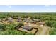 Overhead aerial view of the home within a neighborhood with tree coverage at 13258 Sw 29Th Cir, Ocala, FL 34473