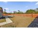 Fenced backyard features a concrete patio and partial lawn at 13258 Sw 29Th Cir, Ocala, FL 34473