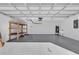 Spacious and clean two car garage with epoxy floor, shelving and white walls at 13258 Sw 29Th Cir, Ocala, FL 34473