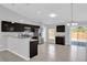 Kitchen featuring stainless steel appliances, dark wood cabinets and granite counters at 13258 Sw 29Th Cir, Ocala, FL 34473