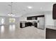 Open-concept kitchen with stainless steel appliances and a view of the living area at 13258 Sw 29Th Cir, Ocala, FL 34473