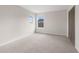 Neutral bedroom with plush carpeting, double windows, and a closet at 13631 Guildhall Cir, Orlando, FL 32828