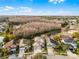 Exterior view of a suburban two-story home with a well-kept lawn and neighborhood lake access at 13631 Guildhall Cir, Orlando, FL 32828