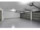 Spacious two-car garage with epoxy flooring and automatic door openers at 13631 Guildhall Cir, Orlando, FL 32828