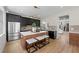 Well-designed kitchen with black cabinets, quartz countertops, a center island, and stainless steel appliances at 13631 Guildhall Cir, Orlando, FL 32828