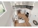 Bright living room with high ceilings, black railings, wood floors, and comfortable seating at 13631 Guildhall Cir, Orlando, FL 32828