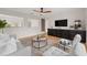 Bright living room featuring a decorative fireplace, neutral colors, hardwood floors and modern furnishings at 13631 Guildhall Cir, Orlando, FL 32828