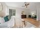 Spacious main bedroom with wood floors, natural light, and neutral tones at 13631 Guildhall Cir, Orlando, FL 32828