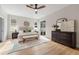 Spacious main bedroom with wood floors, natural light, and neutral tones at 13631 Guildhall Cir, Orlando, FL 32828