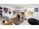 Bright bedroom featuring a loft bed with desk, and playful decor under a sunlit window at 14 E Cypress St, Davenport, FL 33837