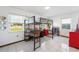 Airy bedroom featuring a loft bed and playful decor, illuminated by natural light from two windows at 14 E Cypress St, Davenport, FL 33837