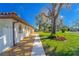 Charming single-story home with a red tile roof, gravel landscape and sidewalk at 14 E Cypress St, Davenport, FL 33837