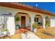 Inviting front porch with tile flooring and quaint decorations at 14 E Cypress St, Davenport, FL 33837