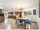 Eat-in kitchen with a dining table set and a chandelier for warm, inviting dining at 14 E Cypress St, Davenport, FL 33837