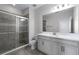 Bathroom with a glass-enclosed shower and vanity with a white countertop at 14101 Creekbed Cir, Winter Garden, FL 34787