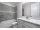 Bathroom featuring a tiled tub/shower combination and a vanity with a white countertop at 14101 Creekbed Cir, Winter Garden, FL 34787