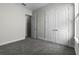 Spacious bedroom with a double closet and view of entry at 14101 Creekbed Cir, Winter Garden, FL 34787