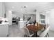 Bright kitchen with an island, stainless steel appliances, and an adjacent dining area at 14101 Creekbed Cir, Winter Garden, FL 34787