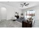 Bright living room with tile floors, stylish furniture, and sliding glass doors to the patio at 14101 Creekbed Cir, Winter Garden, FL 34787