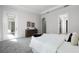 Beautiful bedroom featuring neutral color palette, tray ceiling and patio access at 14101 Creekbed Cir, Winter Garden, FL 34787